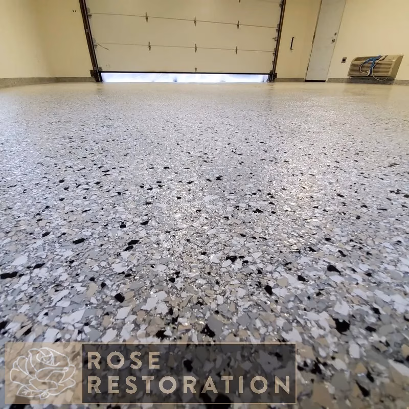 Completed decorative epoxy flake garage floor coating by Rose Restoration