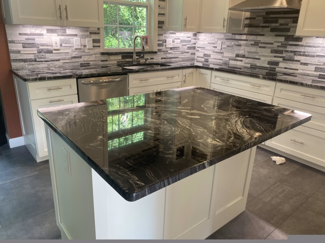 Granite countertop after professional restoration showing polished finish