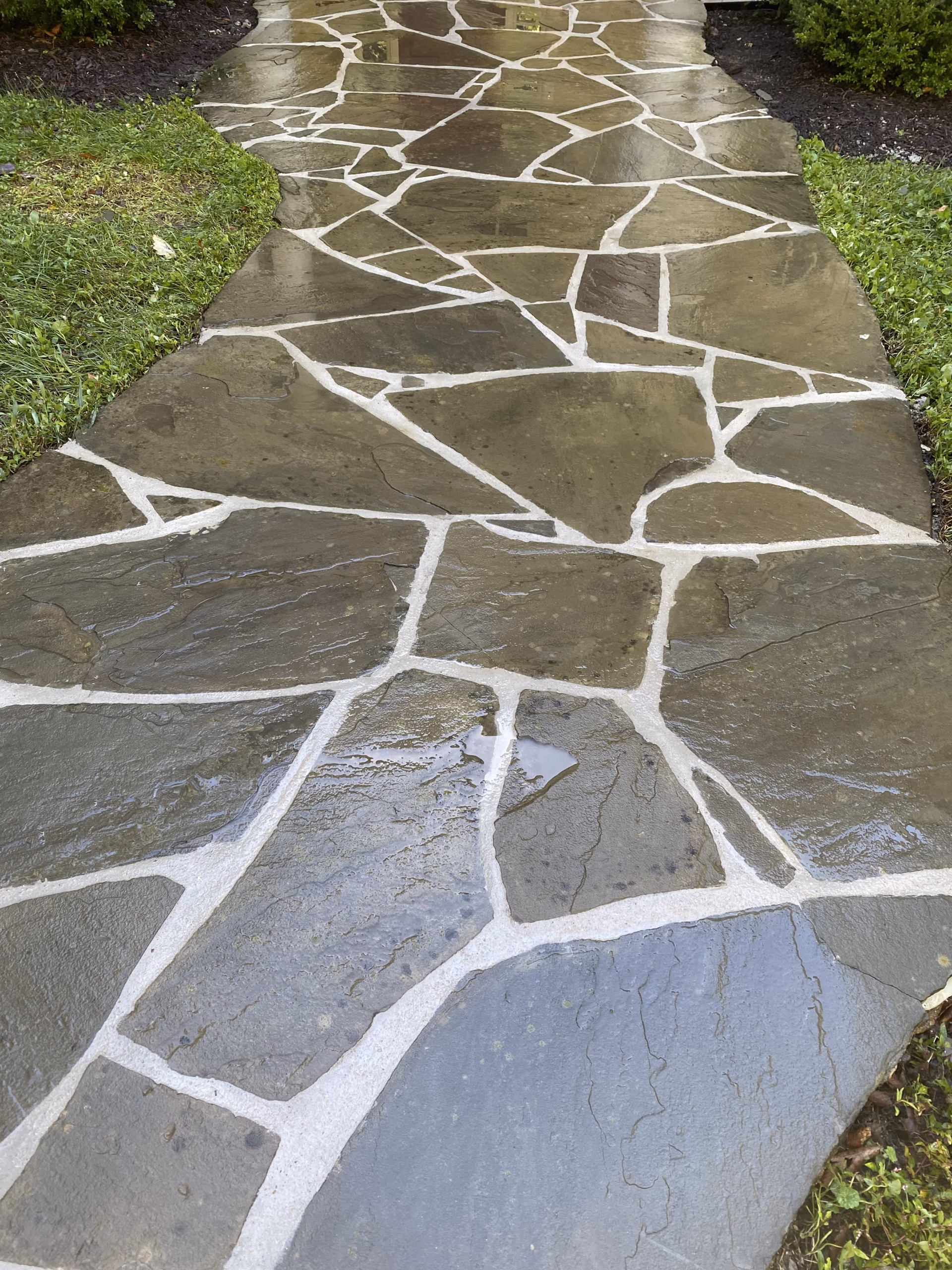 Outdoor stone patio surface cleaned and sealed for long-term protection