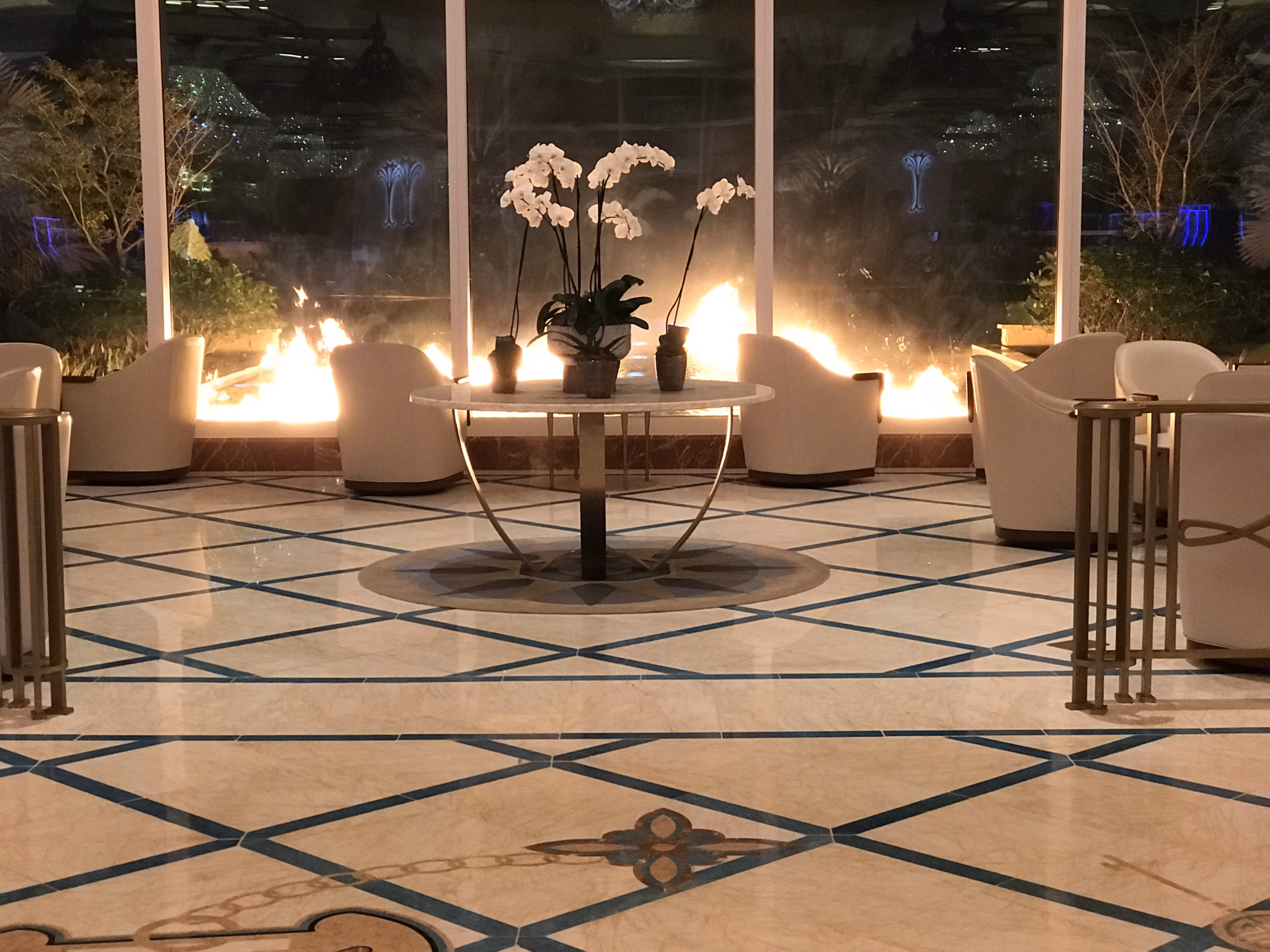 Luxury hotel lobby with polished marble floors and high-end stone finishes