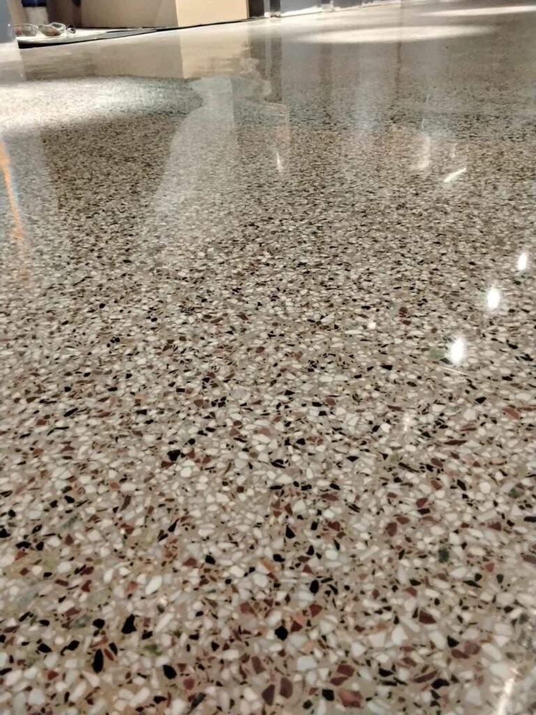 Freshly restored and polished terrazzo lobby floor with multicolor aggregate by Rose Restoration