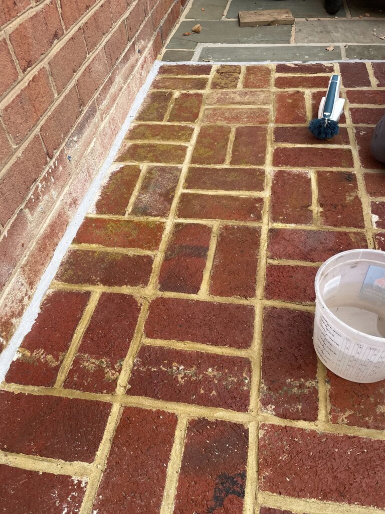 Brick patio repointing in progress by Rose Restoration masonry crew