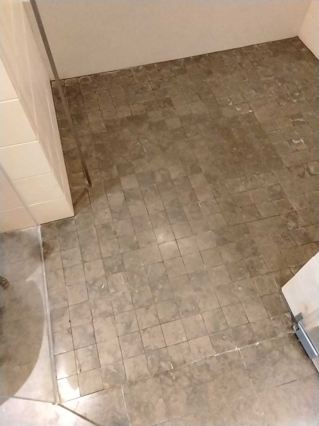 Restored stone mosaic shower in a Potomac Maryland residence by Rose Restoration
