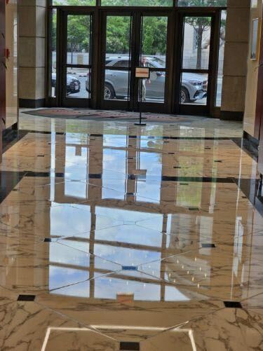 Polished marble elevator lobby with Capitol reflection by Rose Restoration in Washington DC
