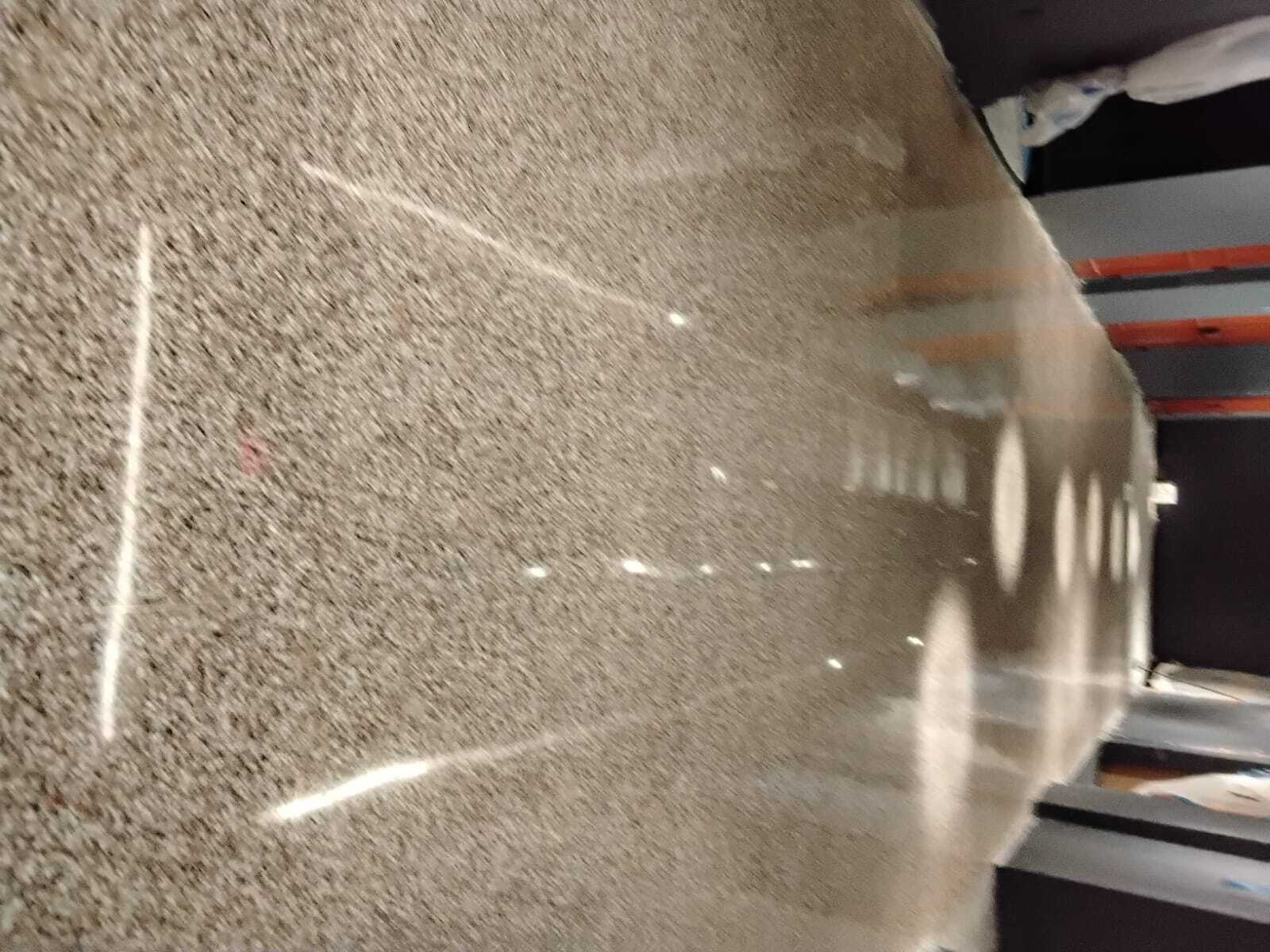 Polished terrazzo floor with a high-gloss mirror finish restored by Rose Restoration
