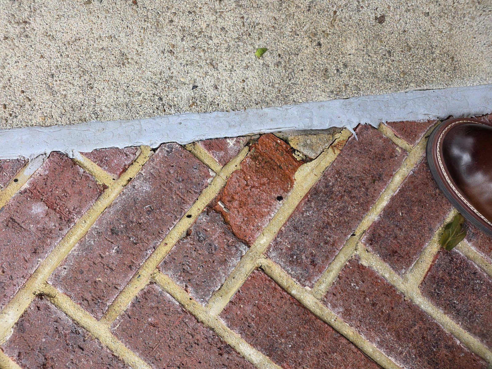 Residential exterior brick walkway or patio before stone restoration work in Arlington VA area