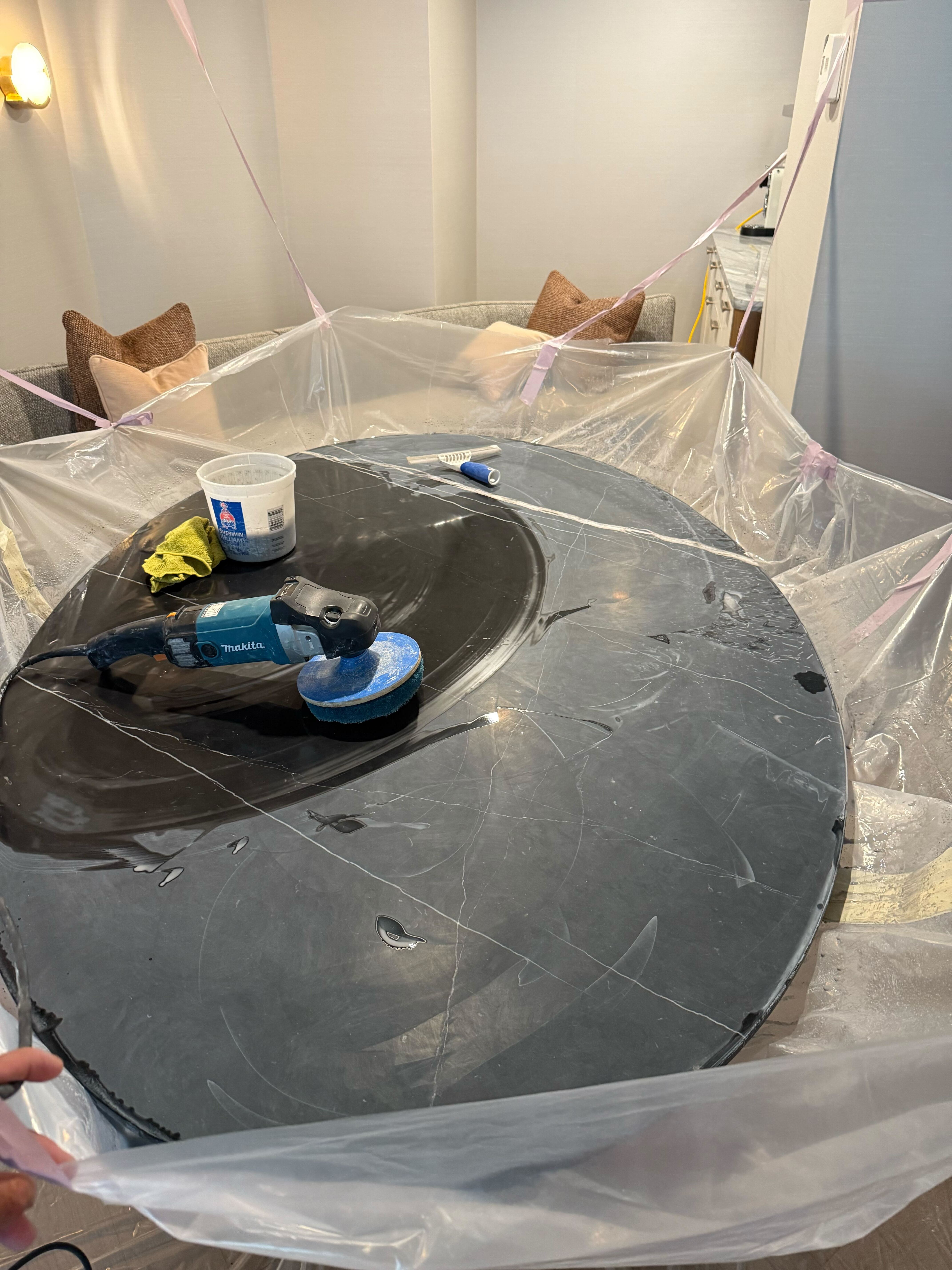 Black marble table polished to mirror finish by Rose Restoration