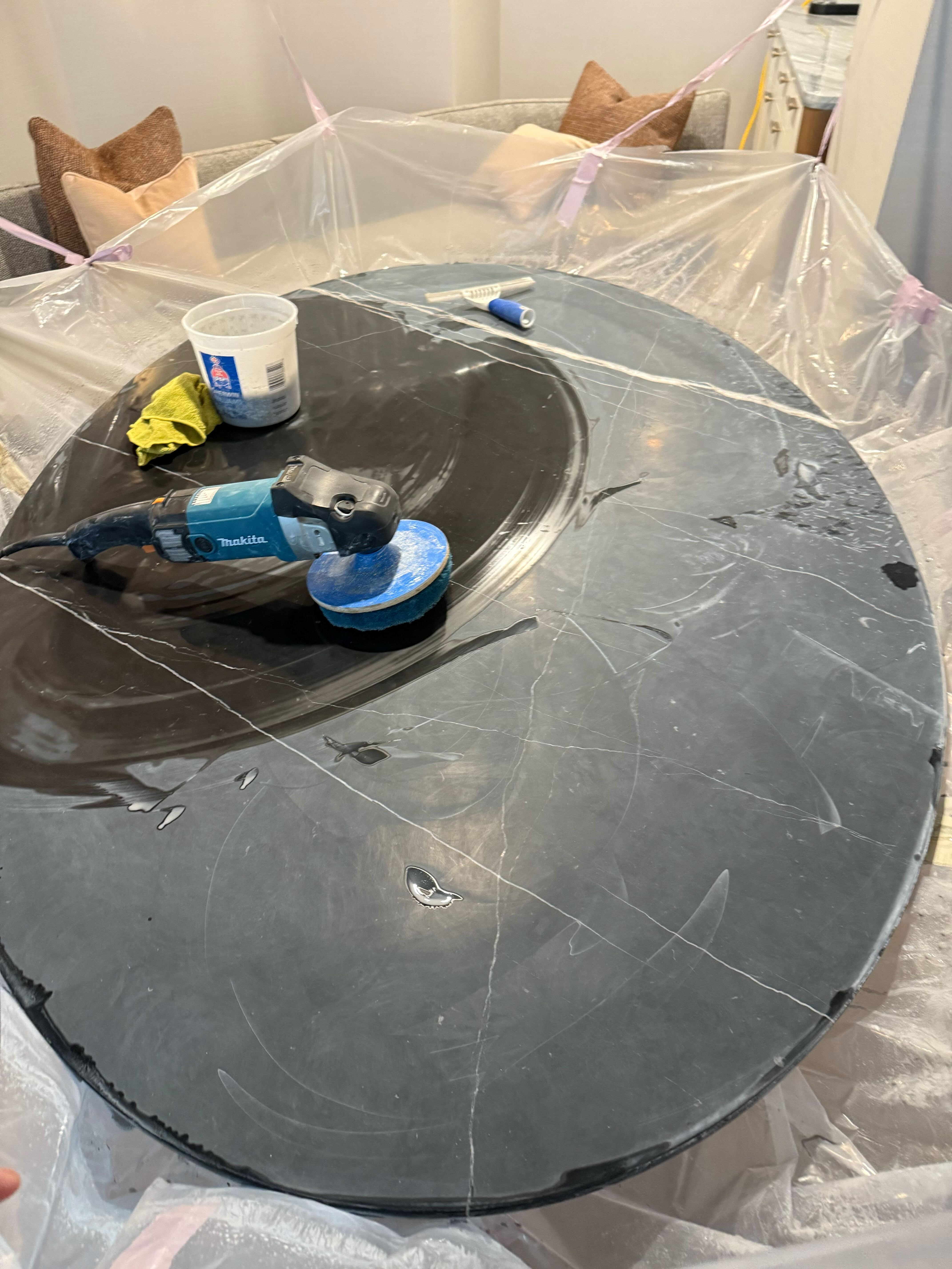 Luxury black marble dining table restored to mirror finish by Rose Restoration