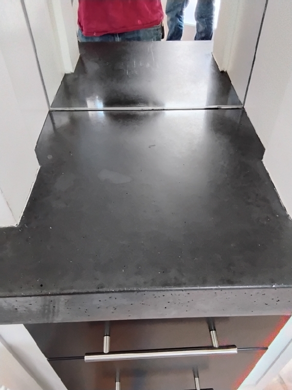 Dyed concrete countertop with mirror finish by Rose Restoration