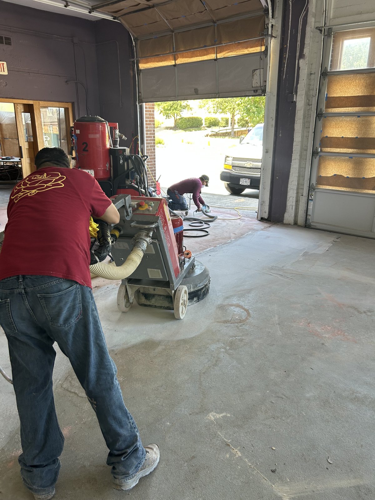Commercial garage floor before resinous flooring installation by Rose Restoration