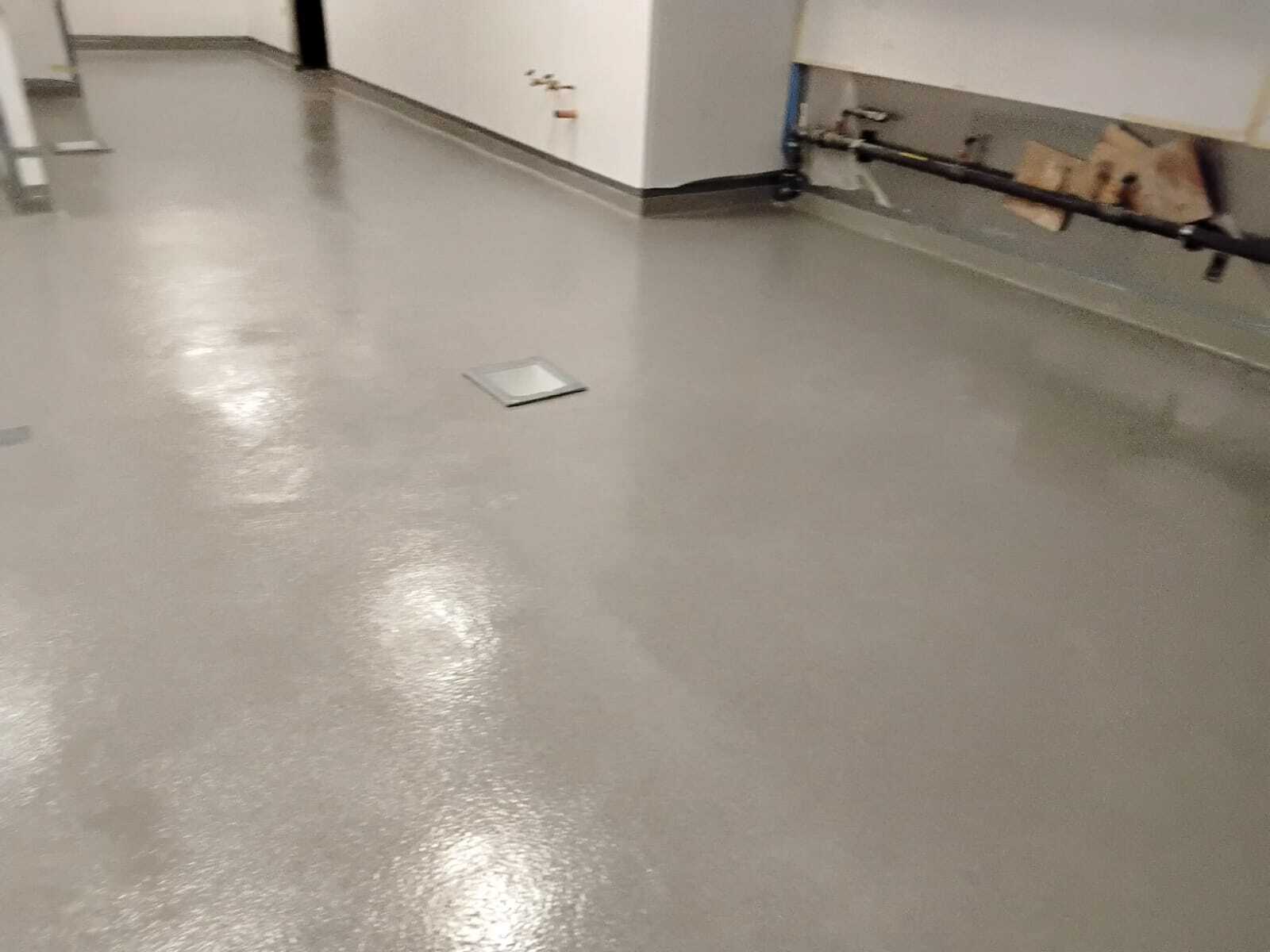 Epoxy urethane floor coating with floor drain in commercial kitchen by Rose Restoration
