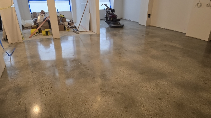 Commercial concrete polishing in progress by Rose Restoration