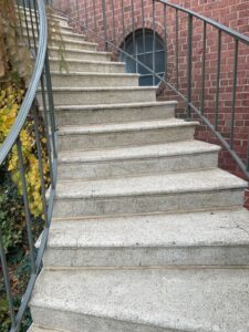 Commercial exterior granite stair treads before professional sealing