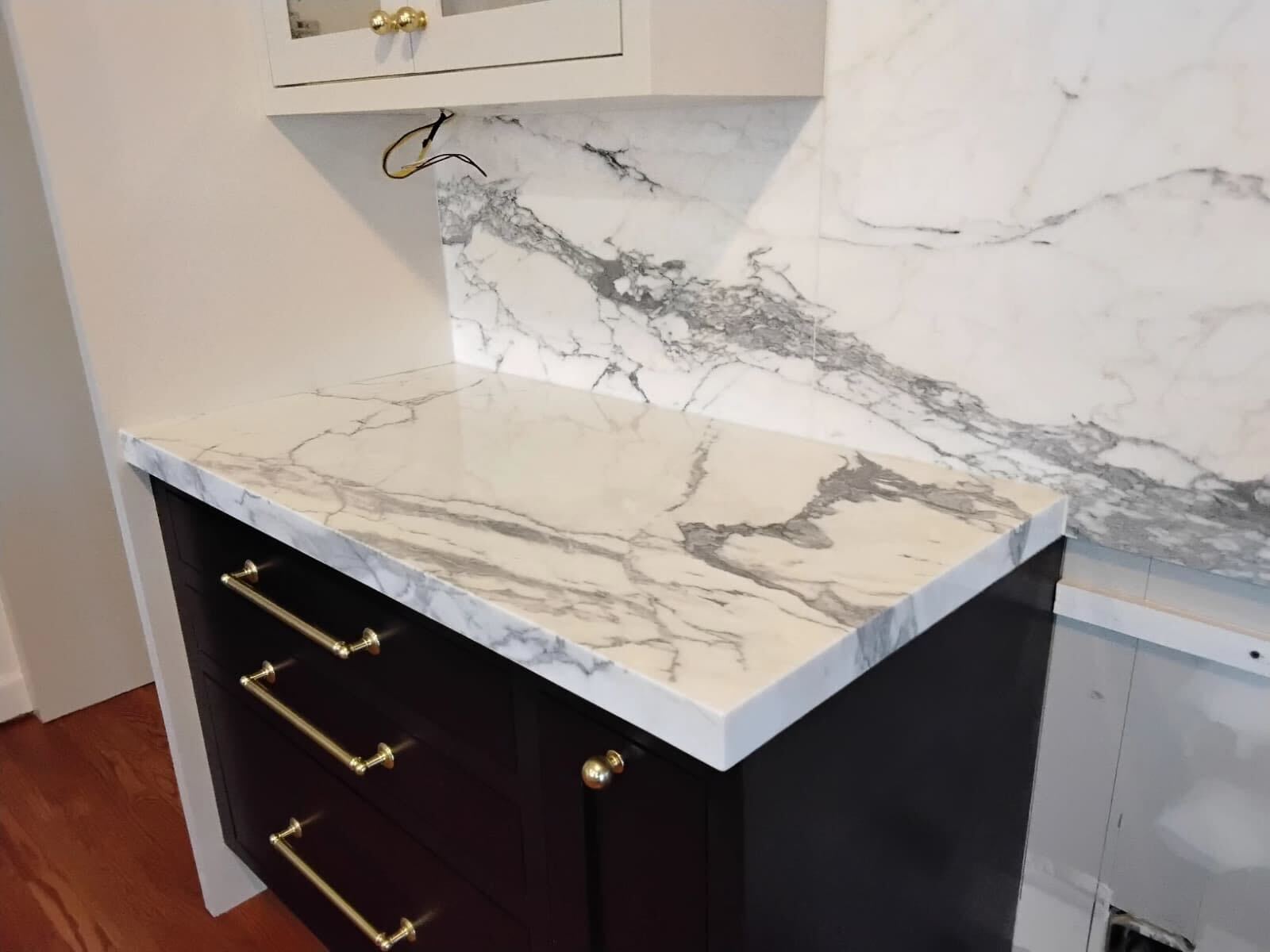 Restored marble kitchen surfaces including countertops and backsplash by Rose Restoration