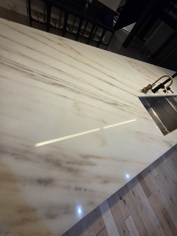 Polished white marble kitchen island by Rose Restoration