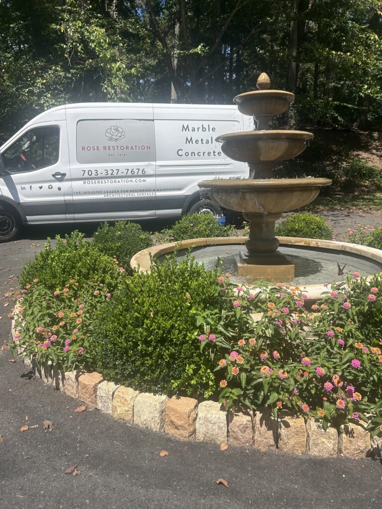 Three-tiered cast stone outdoor fountain restored by Rose Restoration residential team