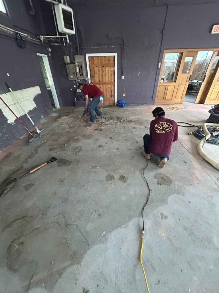 Large commercial concrete floor during professional polishing by Rose Restoration