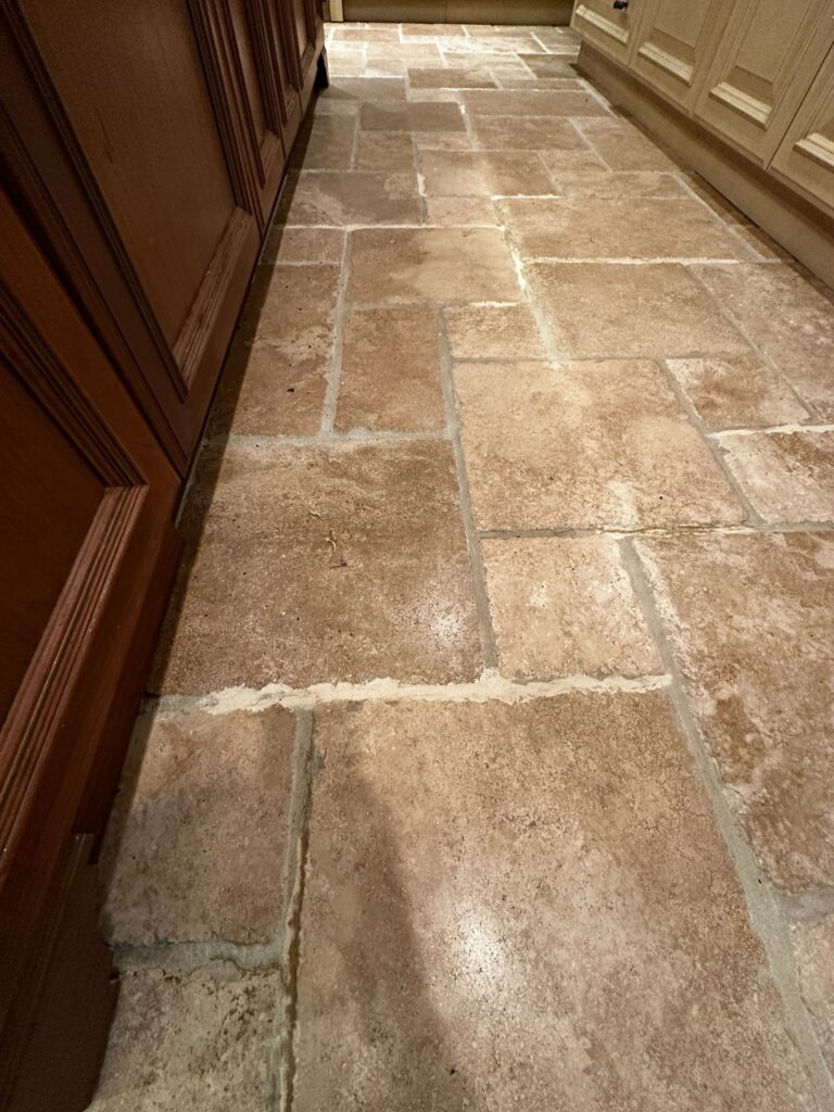 Travertine stone floor with Versailles pattern showing polished finish in luxury home by Rose Restoration