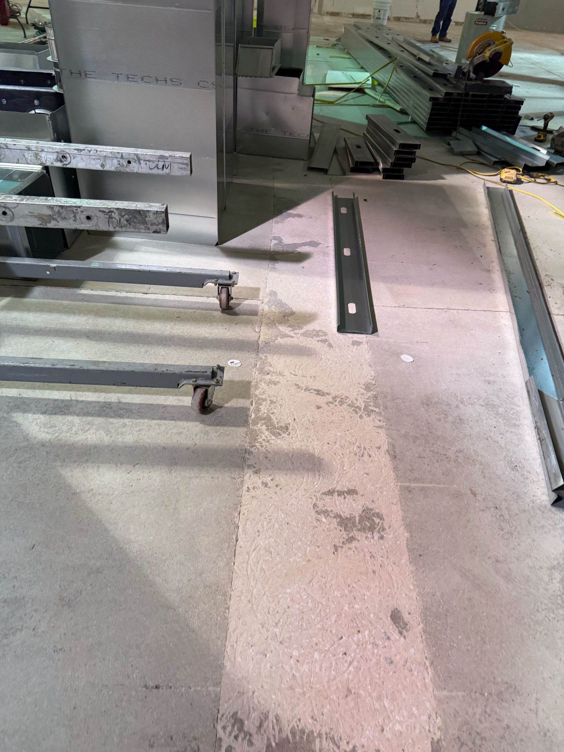 Large-scale commercial concrete polishing in progress at warehouse facility by Rose Restoration