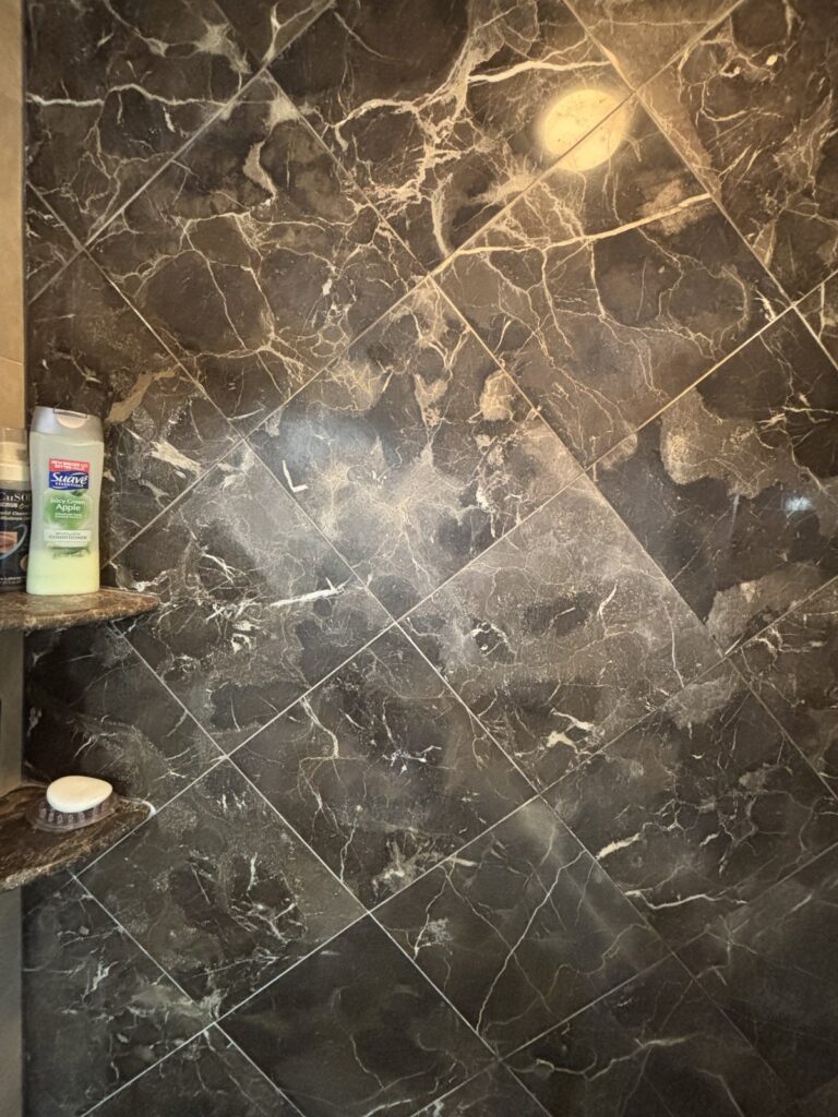Residential marble bathroom floor before Marble Armor protection application