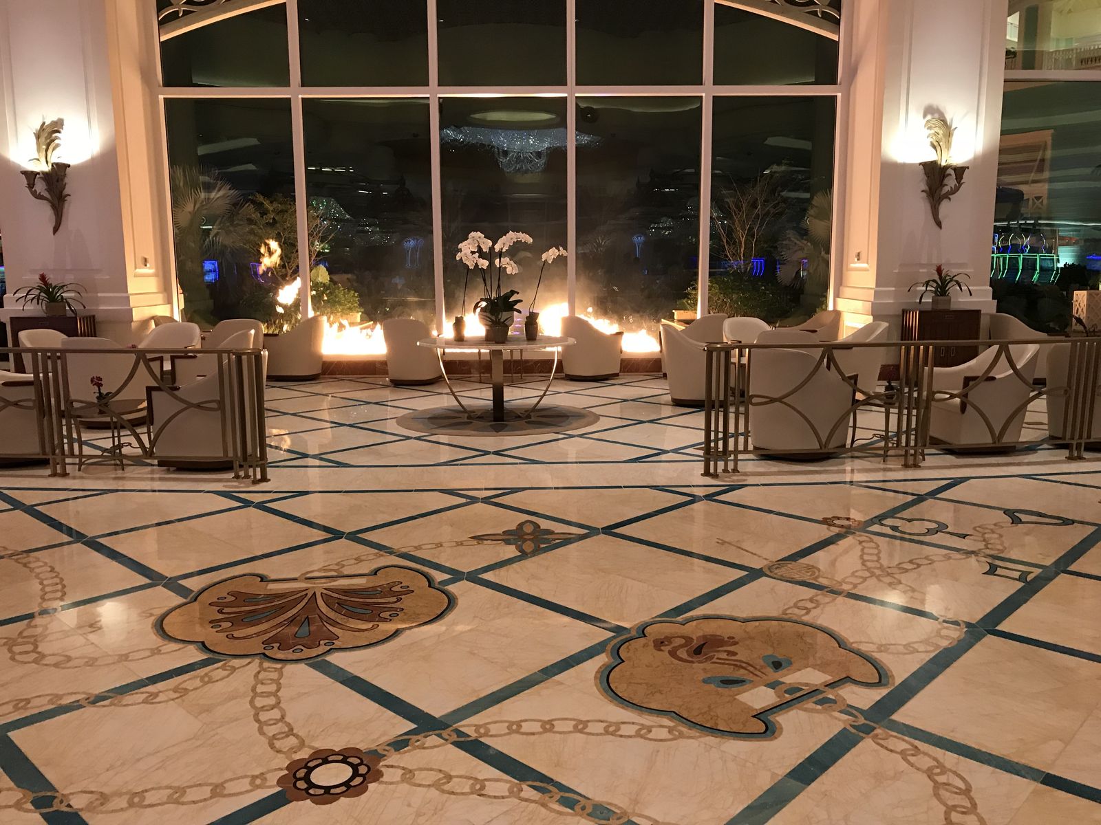 Polished marble medallion floor with brass and stone inlay in the Baha Mar lobby, restored by Rose Restoration