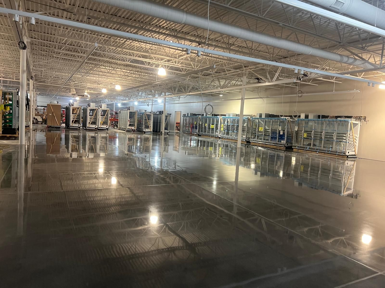Wide view of a polished commercial floor restored by Rose Restoration
