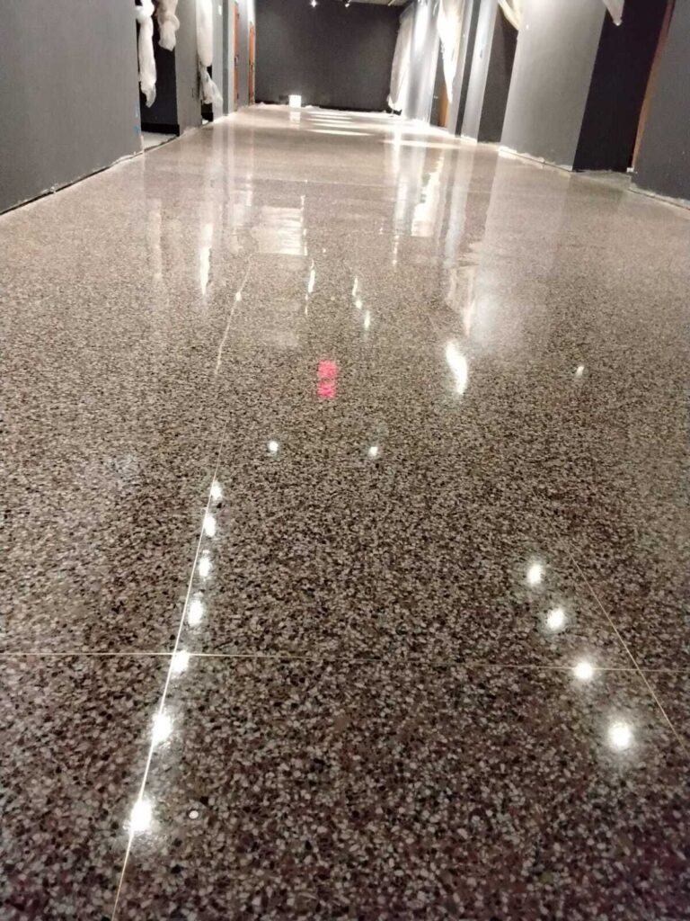 Polished terrazzo corridor floor with a mirror finish