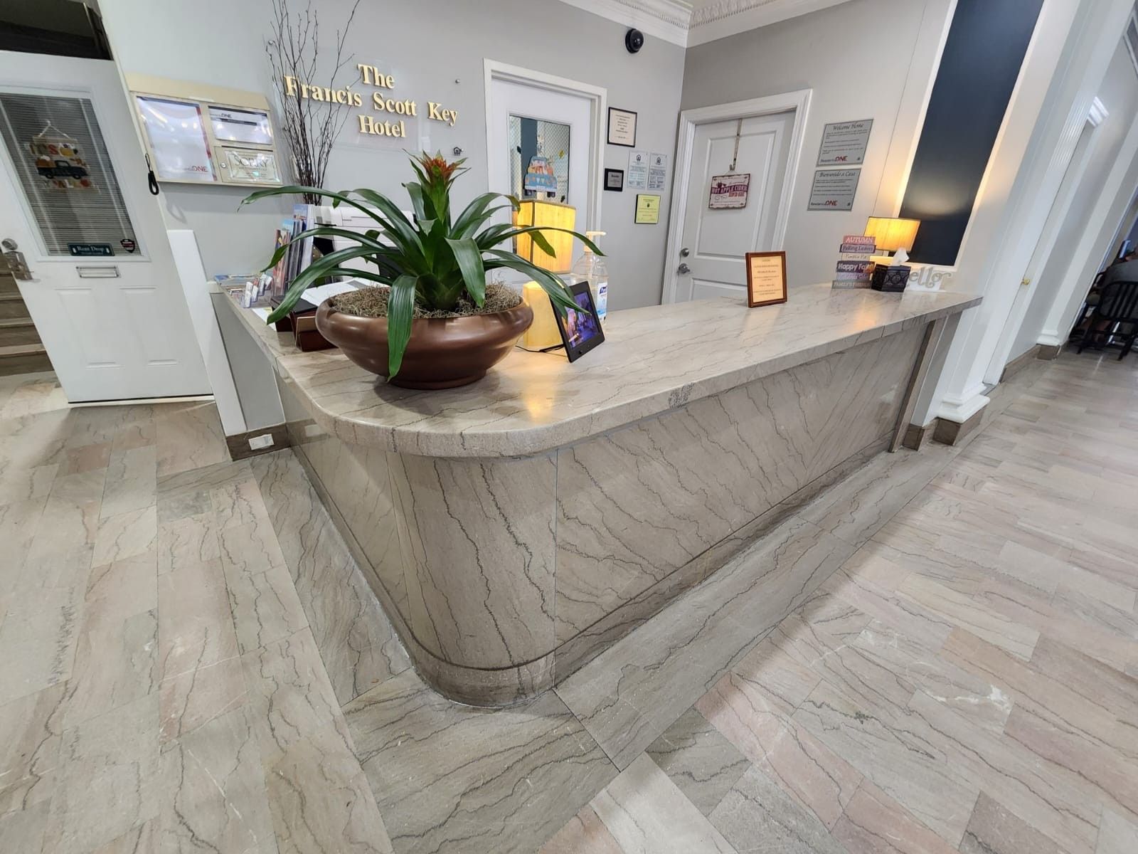 Polished marble reception desk and lobby floor restored by Rose Restoration
