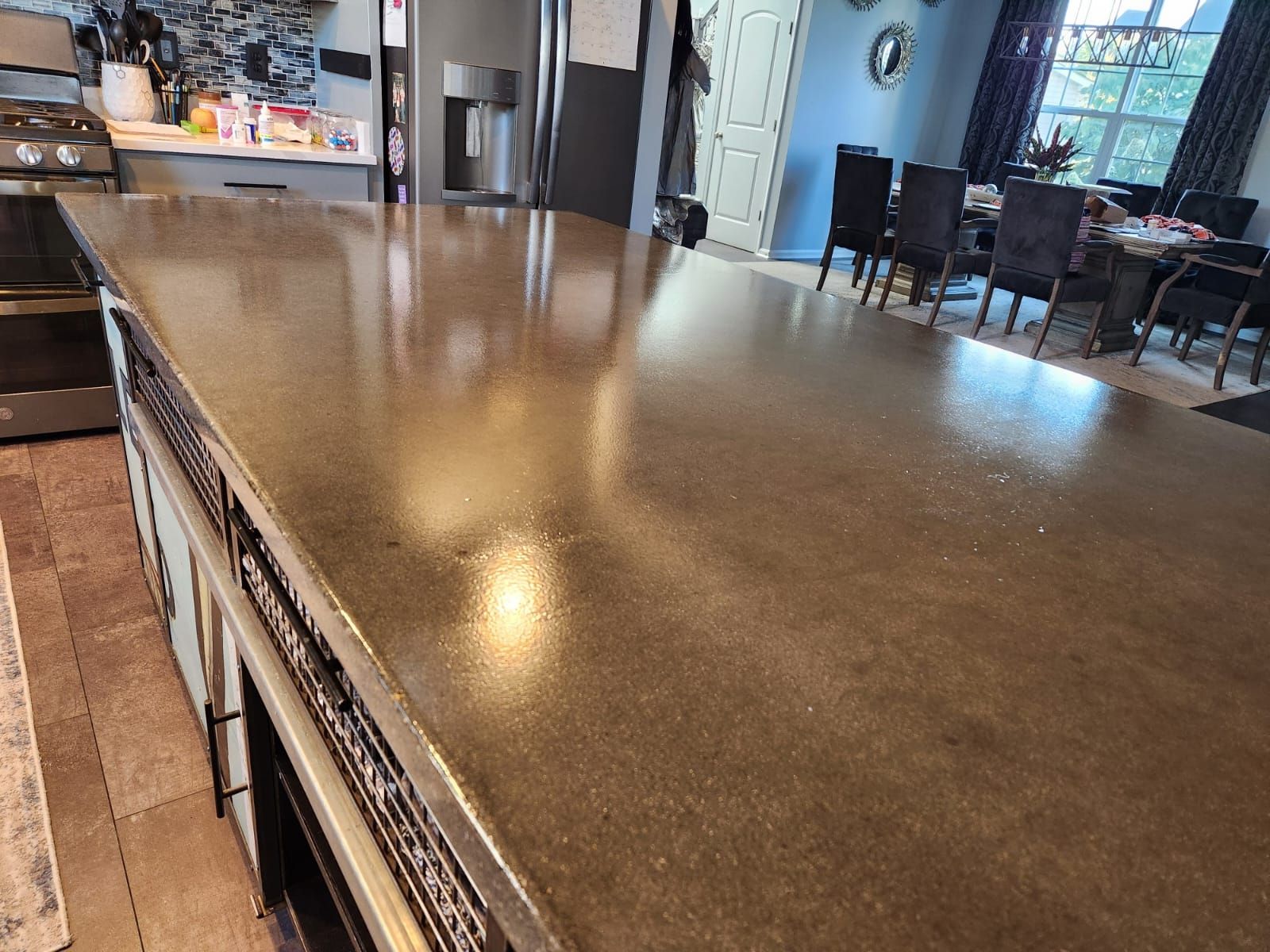 Polished dark stone counter and floor in a restaurant interior by Rose Restoration