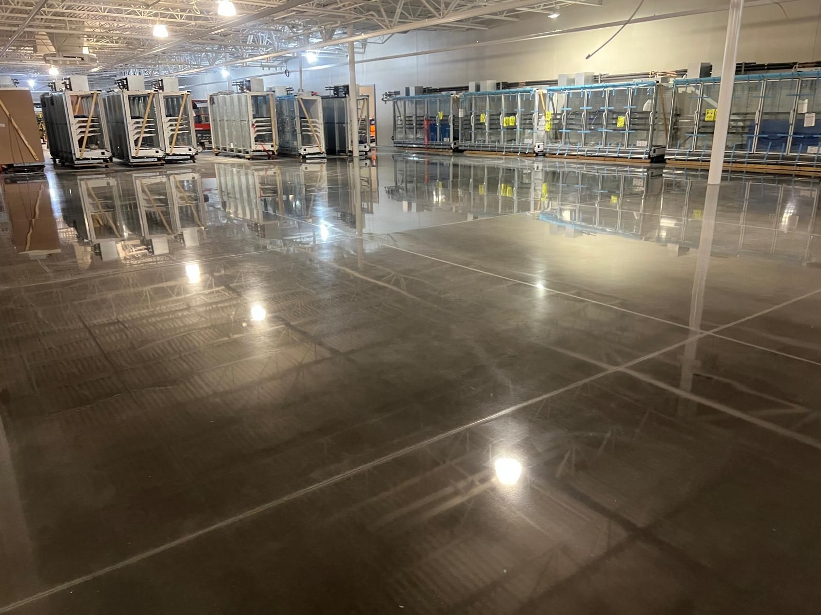 Polished stone floor running through a retail corridor, restored by Rose Restoration