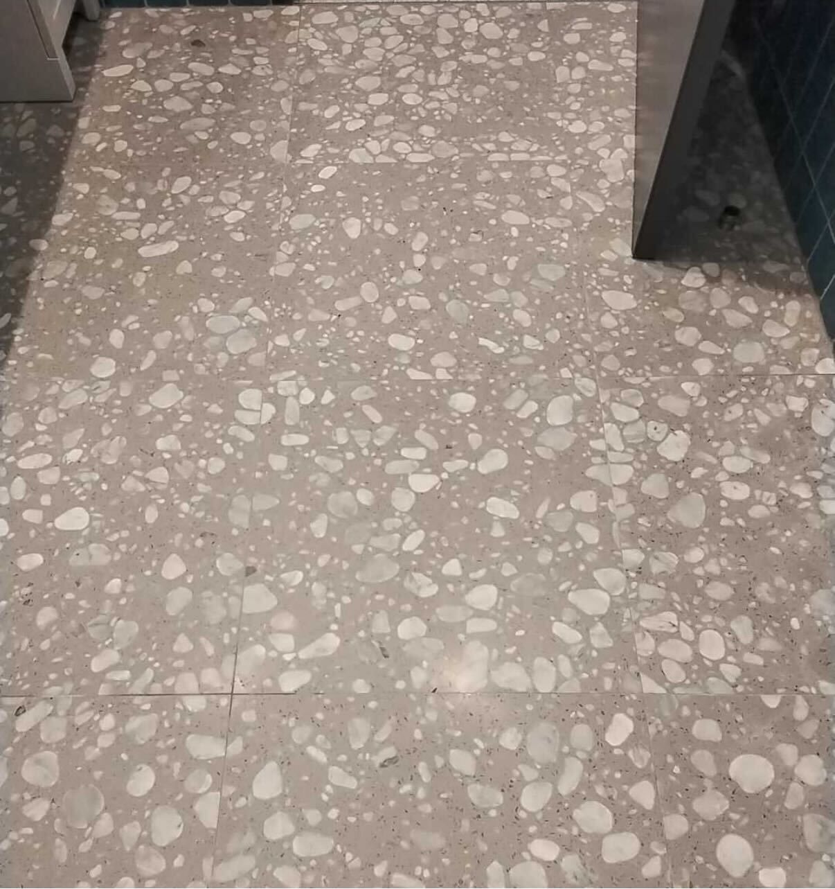Close view of terrazzo aggregate and divider strip after polishing
