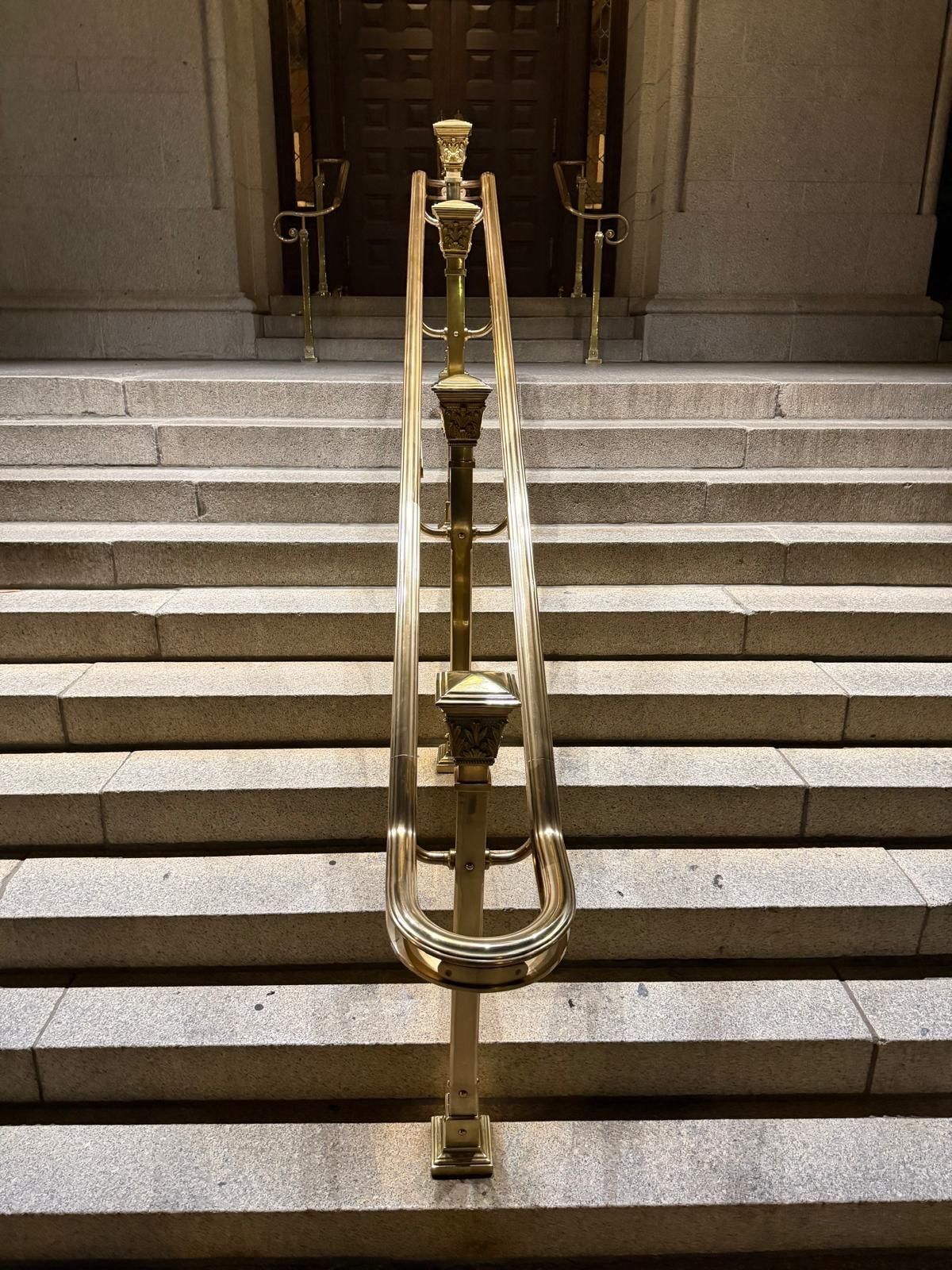 Restored marble staircase with ornate brass railing at the Waldorf Astoria in Washington DC