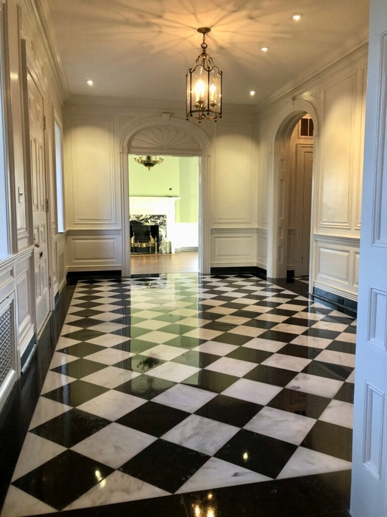 Black and white checkerboard marble hallway floor