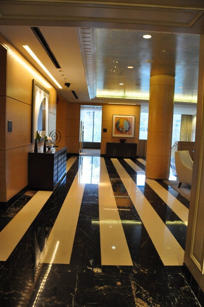 Black and white striped marble corridor floor, polished