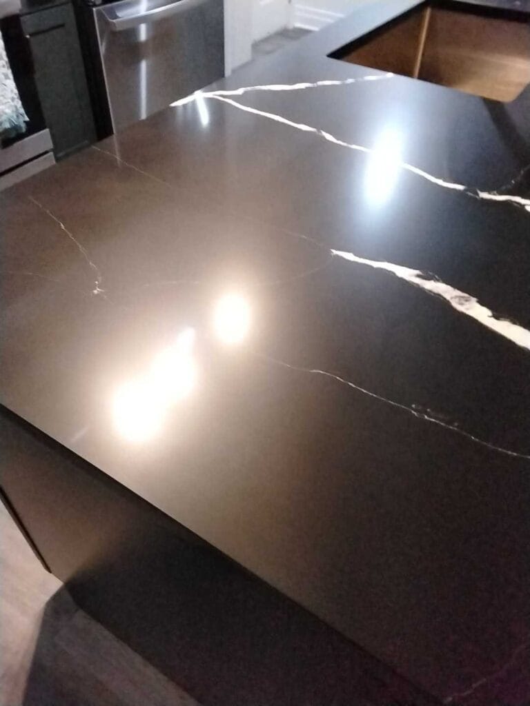 Black stone countertop with white veins from a Rose Restoration job in Arlington, VA