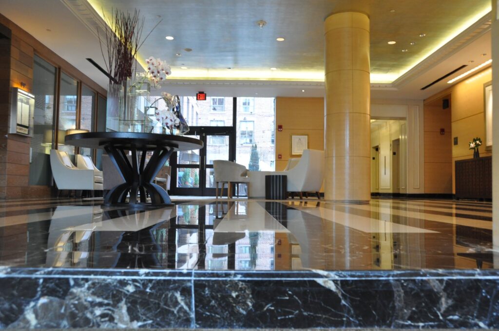Condominium lobby with a black marble inlay floor