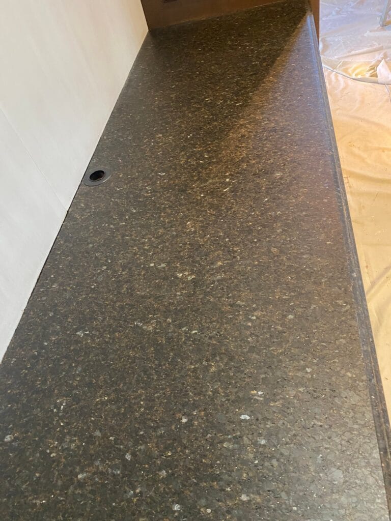 Dark granite countertop, polished