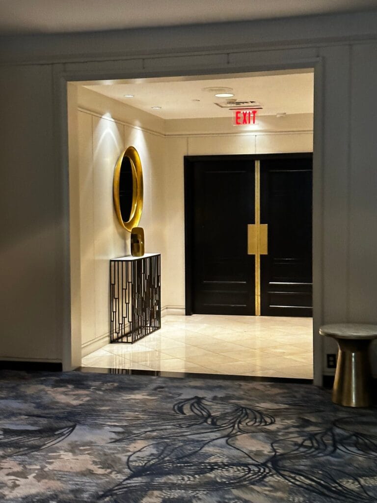 Dark wood doors with brass trim