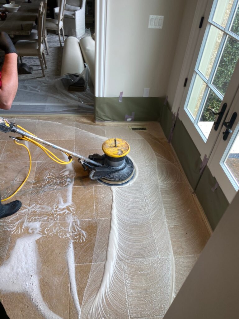 Floor machine cleaning a tile floor