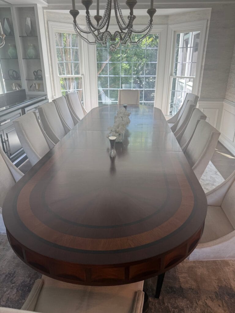 Inlaid wood dining table in a bright dining room