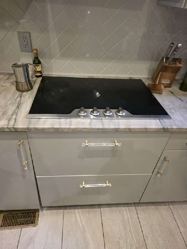 Marble countertop with built-in cooktop from a Rose Restoration job in Washington, DC