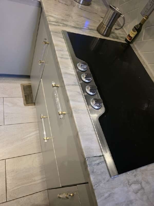 Marble countertop with cooktop from a Rose Restoration job in Washington, DC