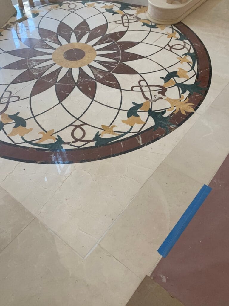 Marble floor medallion with a floral inlay