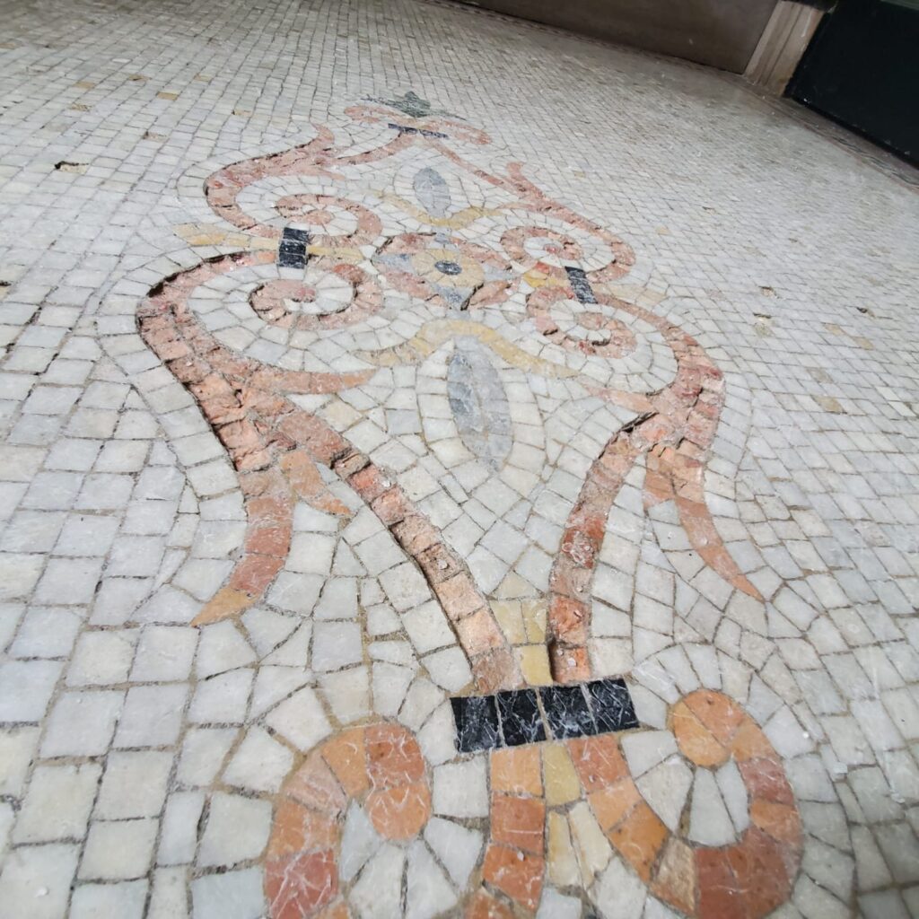 Marble mosaic floor with an ornamental inlay