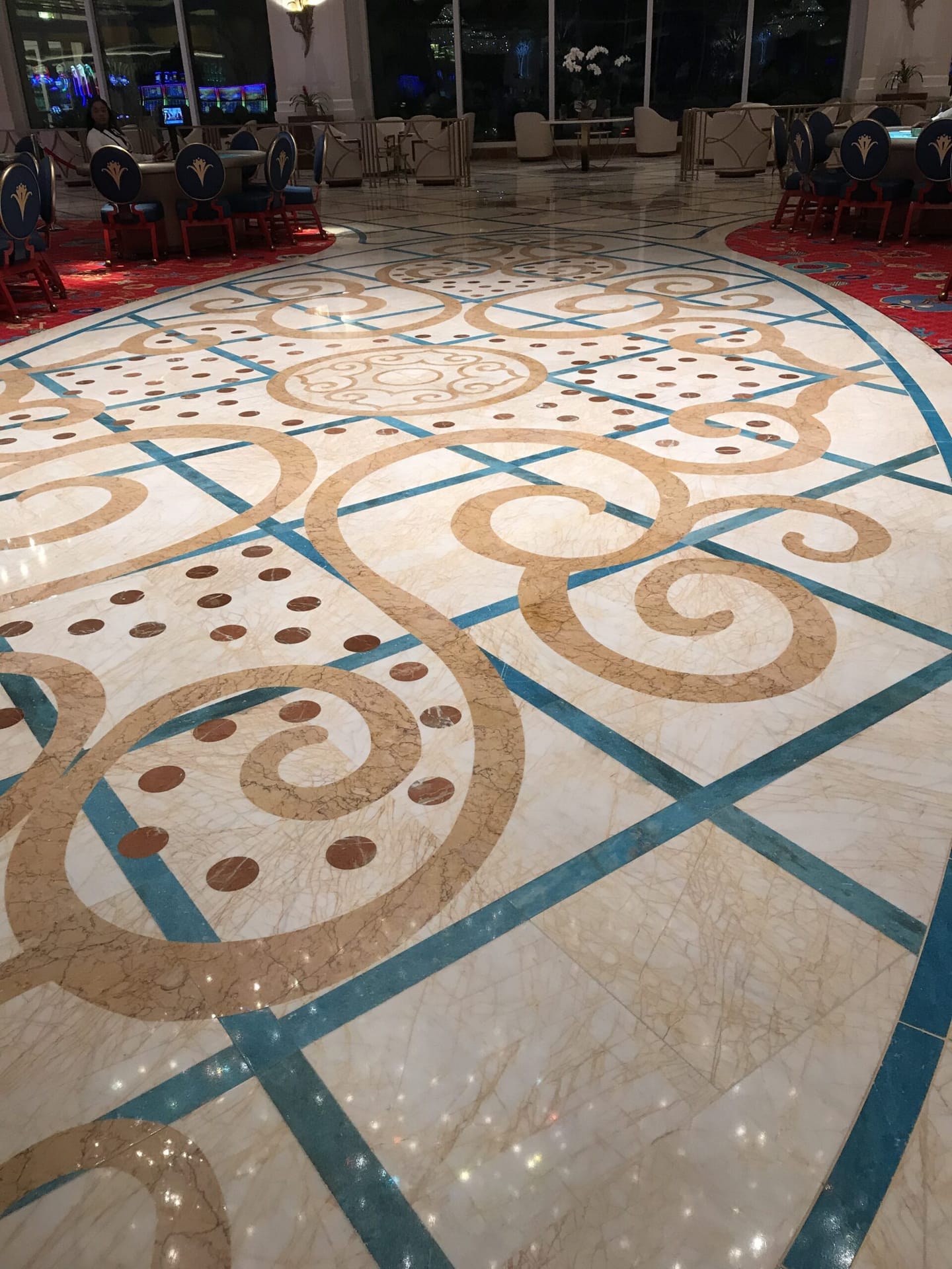 Decorative marble inlay floor with scrollwork and coloured stone banding, polished by Rose Restoration
