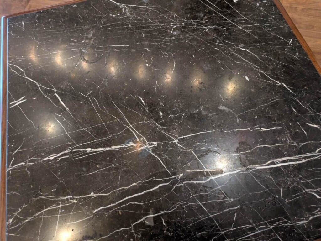 Polished black marble with white veining