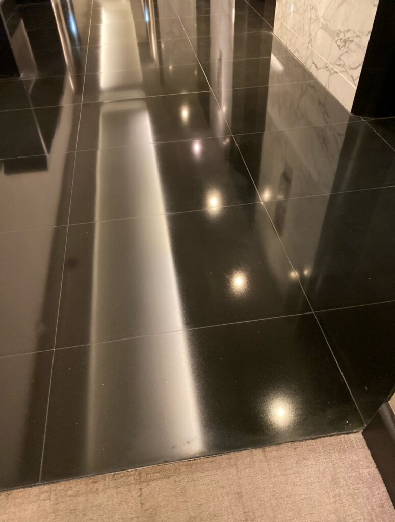 Polished black stone corridor floor