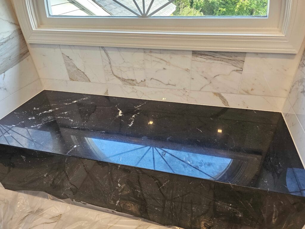 Polished black stone countertop from a Rose Restoration job in Annandale, VA