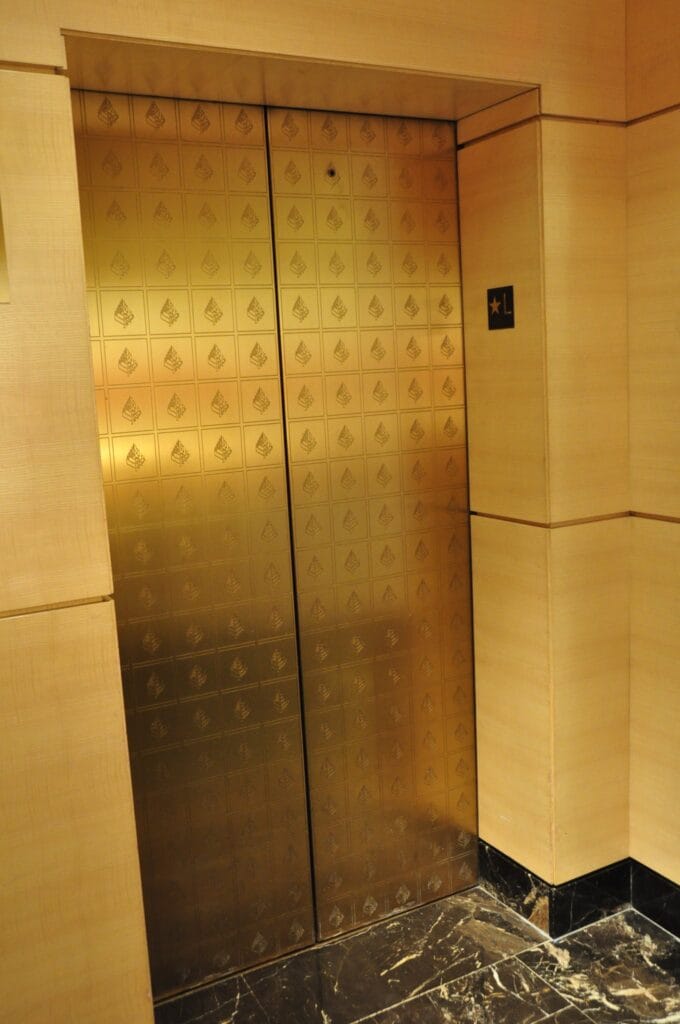Polished brass elevator door