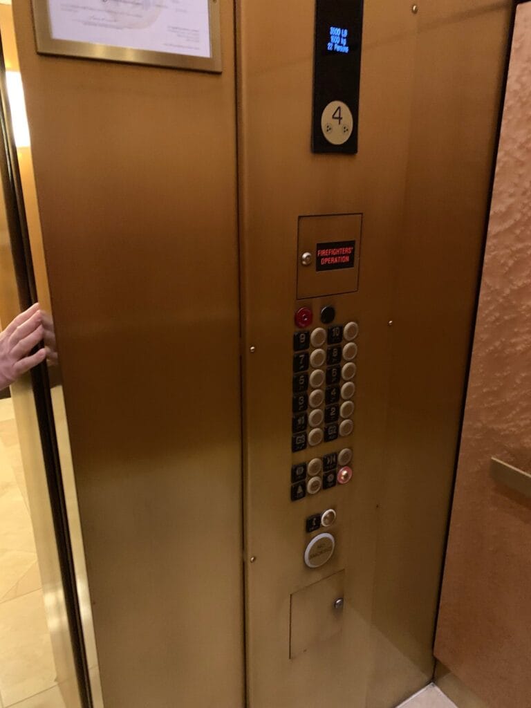 Polished brass elevator door and call panel